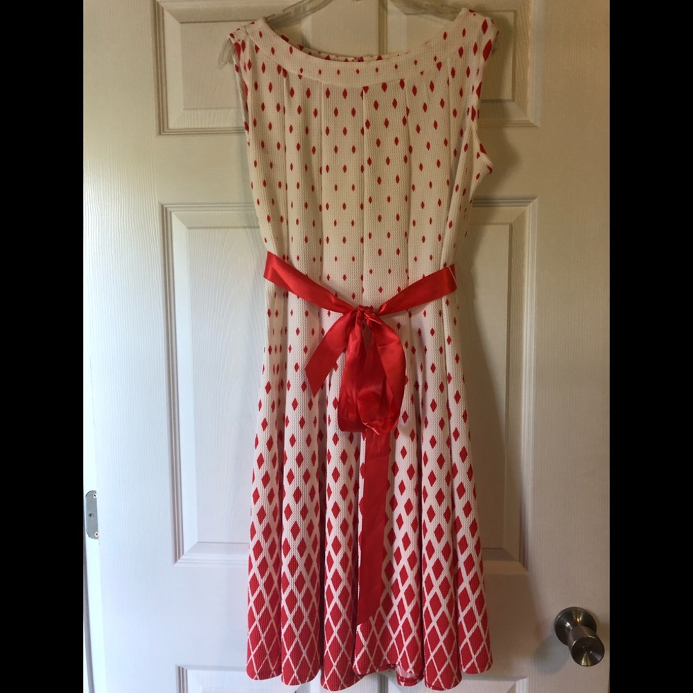 Orange and white sleeveless dress.